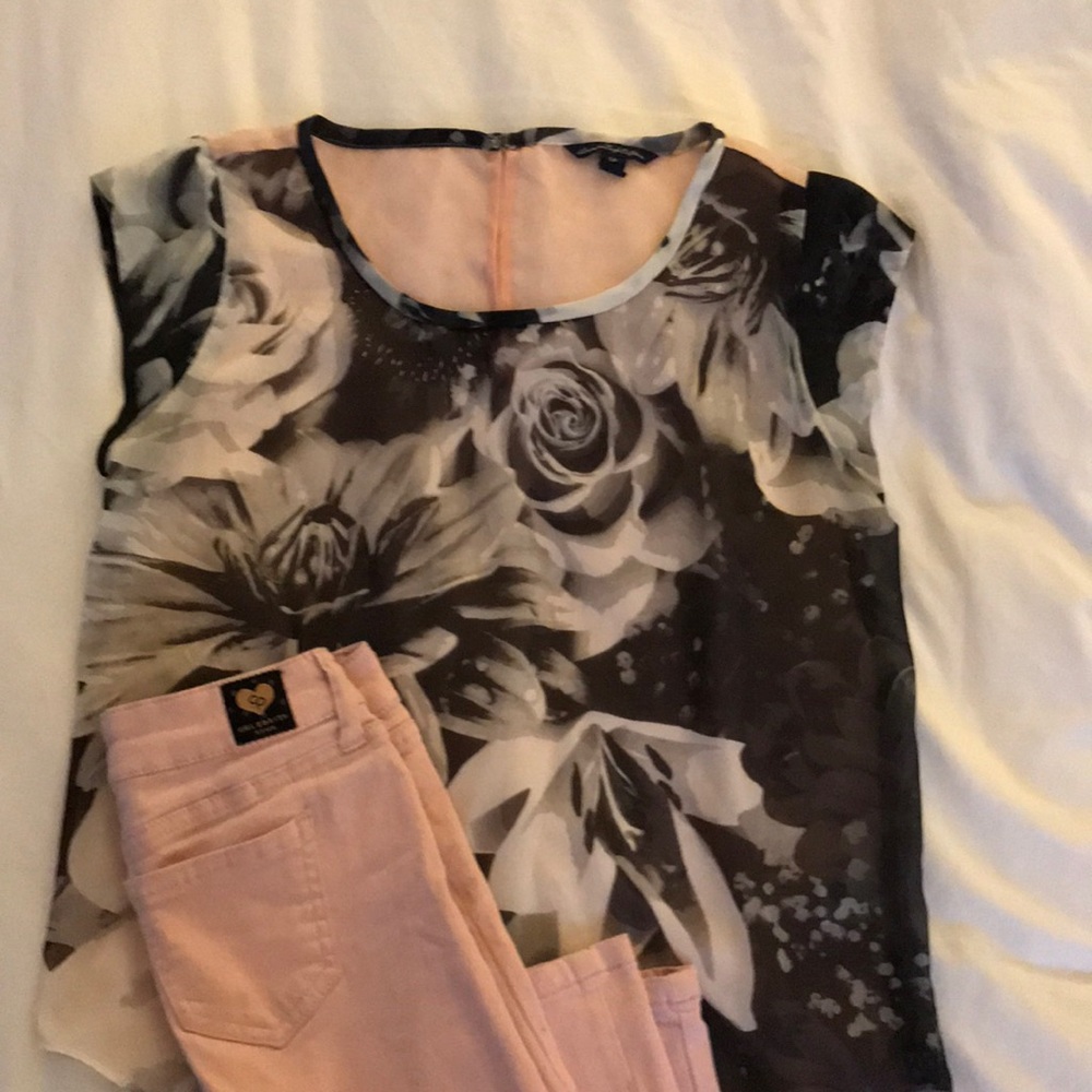 Pink pants with black and floral top.